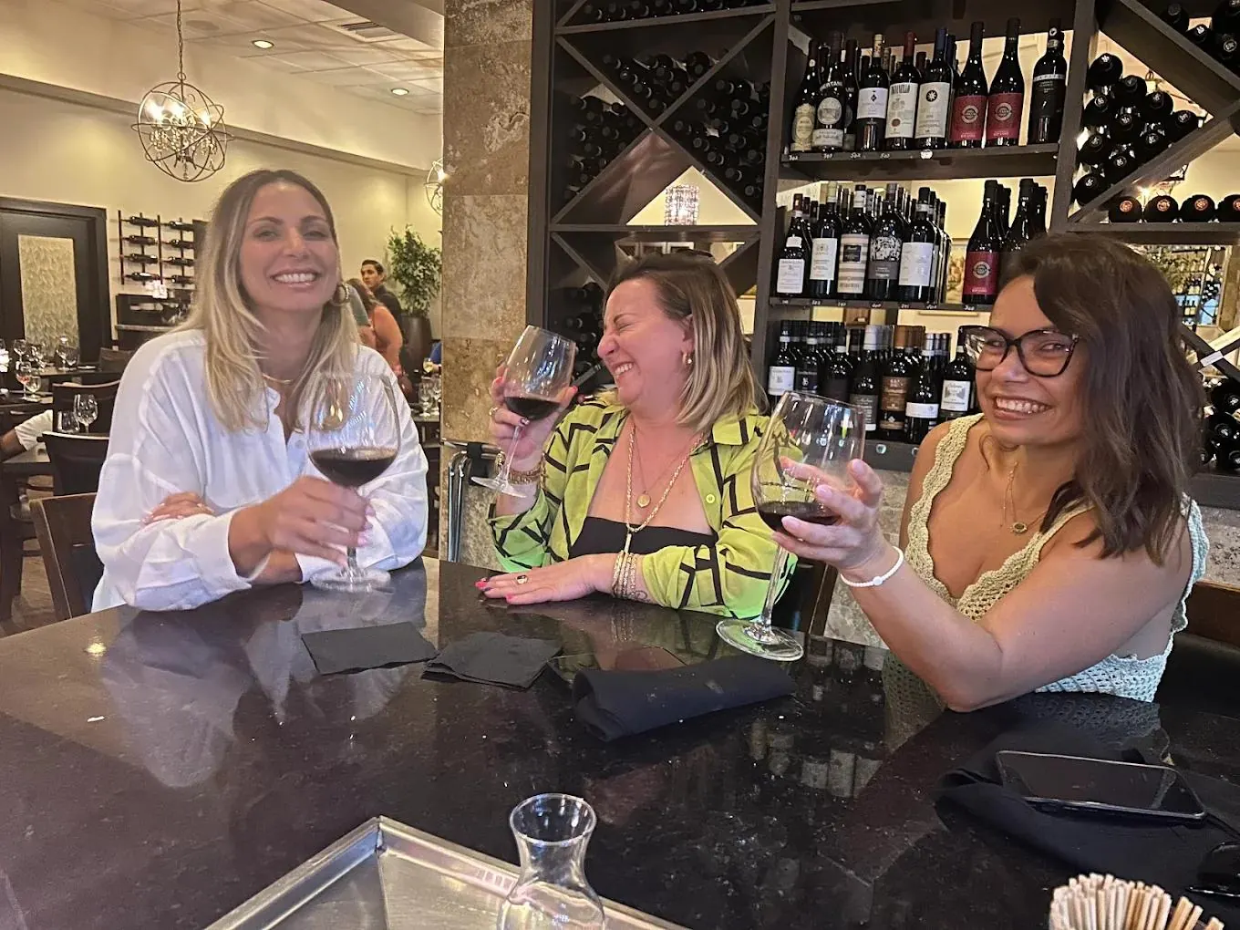 Friends enjoying wine together at Vincenzo Orlando