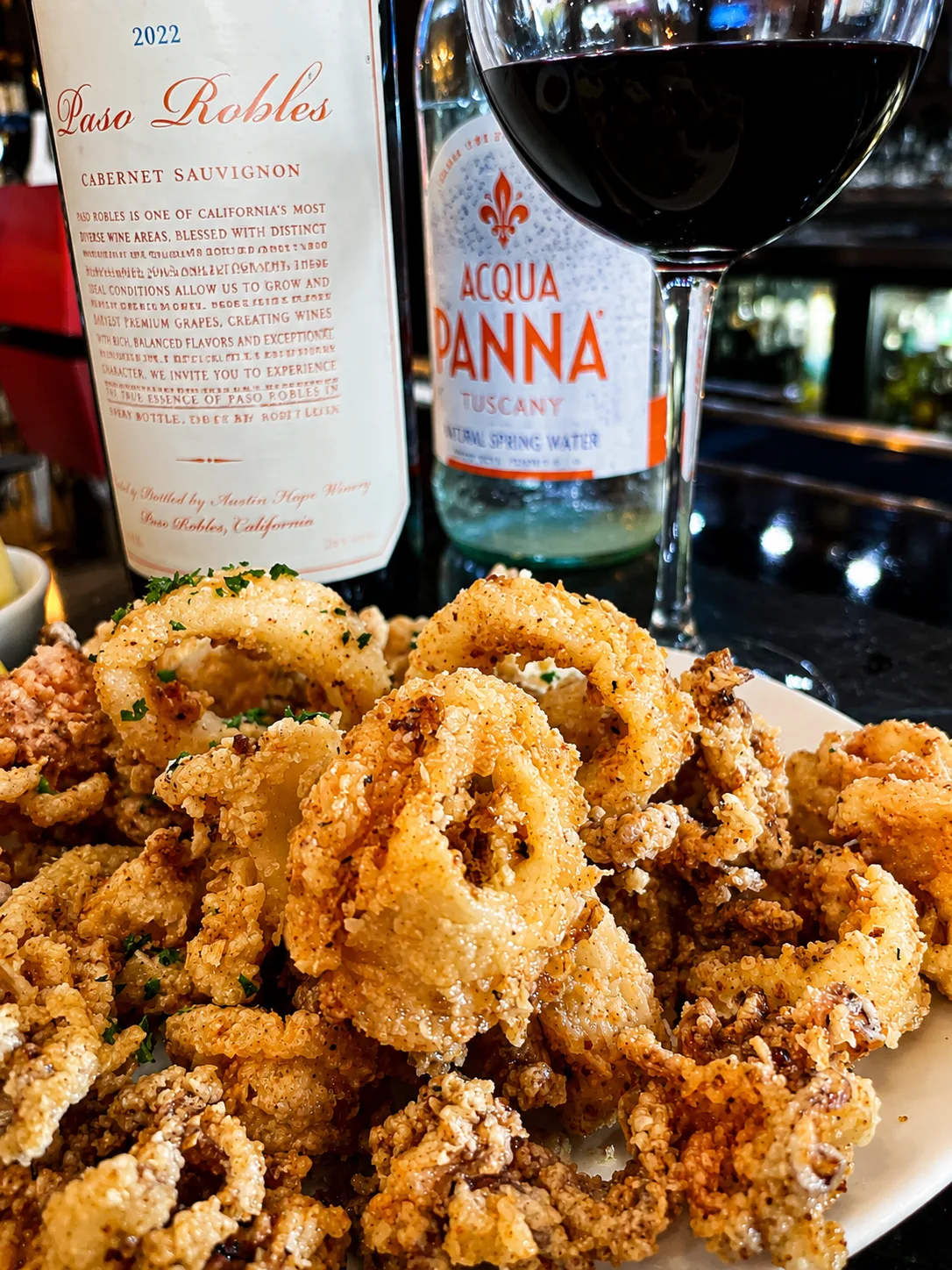 Sautéed calamari and wine at Vincenzo Cucina Italiana Orlando
