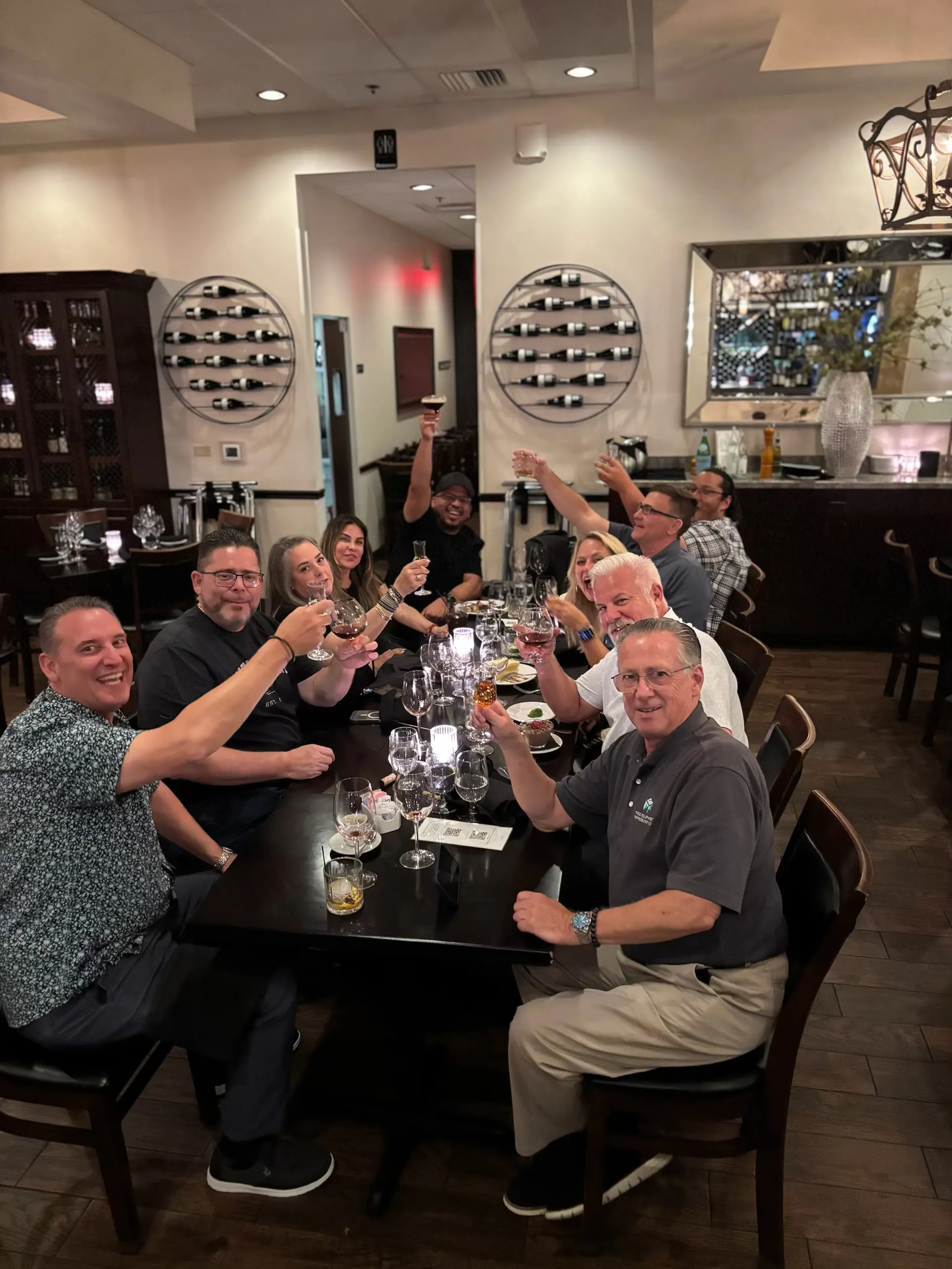 Group toasting at a milestone celebration at Vincenzo Orlando