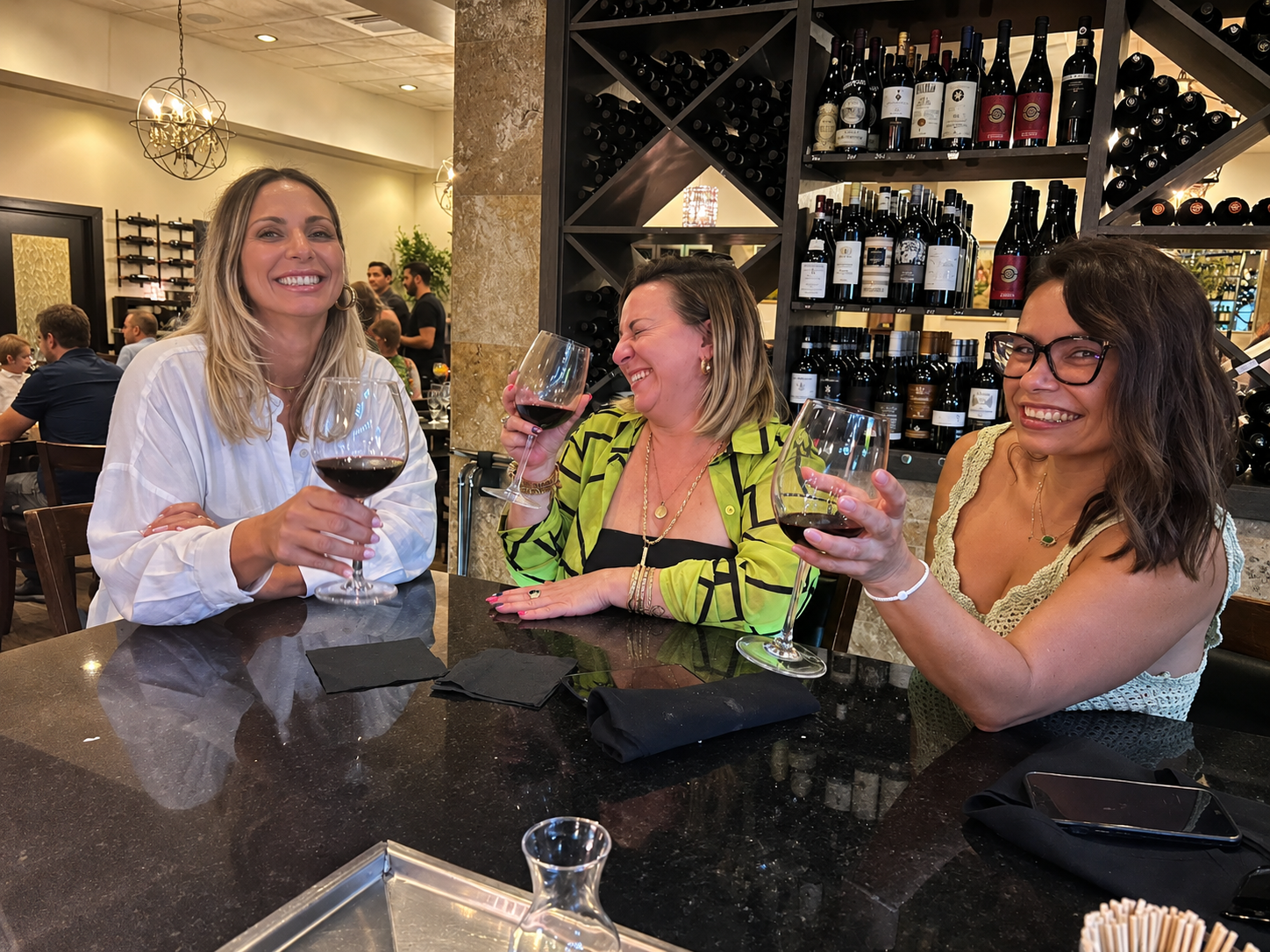 Women enjoying wine at Vincenzo bar casual Italian restaurant International Drive